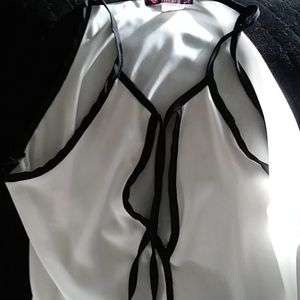 "Myth" beautiful sleeveless top,white with black trim tie at neck in front
